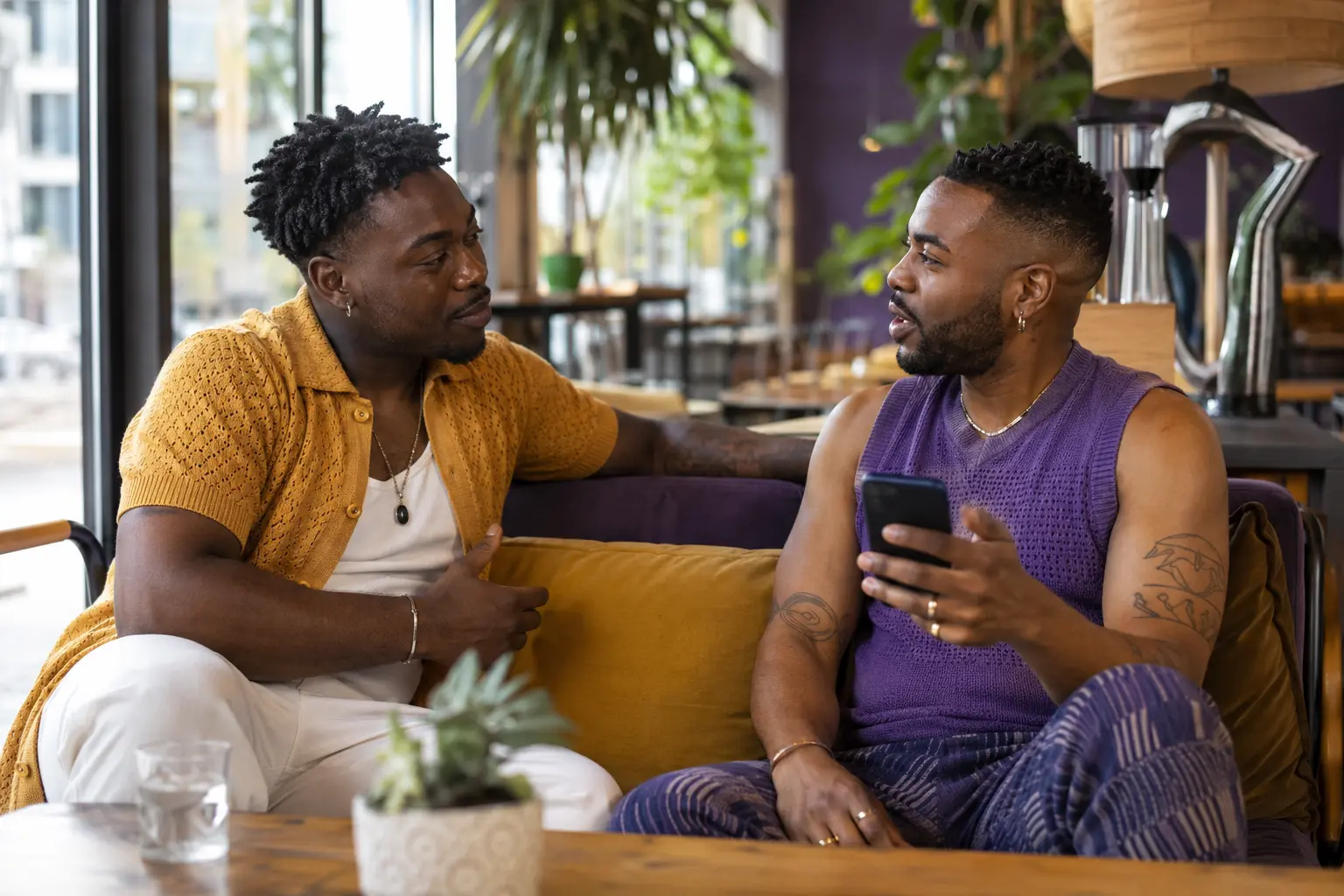 Two Black LGBTQ+ adults talking through prevention planning together